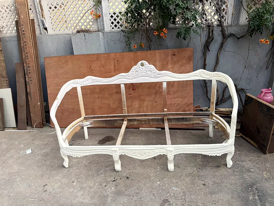 Carved sofa frame in the atelier