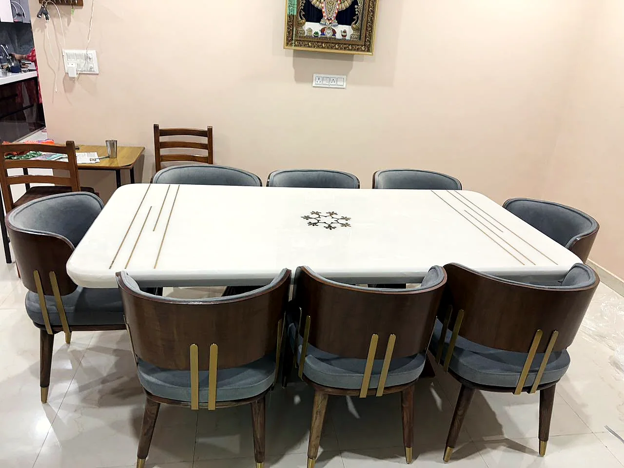 Marble dining table with brass inlay and walnut chairs