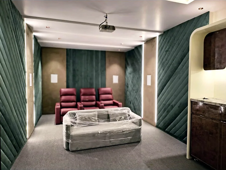 Private home theatre with acoustic panelling and recliners